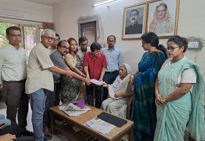 Members of the Bangladesh Hindu Law Reform Council hand over an 11-point memorandum to Deputy Leader of Parliament Begum Matia Chowdhury at her Dhaka residence.
